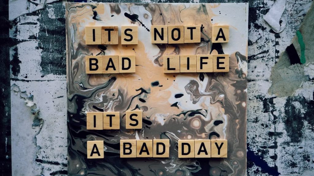 Inspirational quote on artistic marble background with positive message.