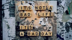 Inspirational quote on artistic marble background with positive message.